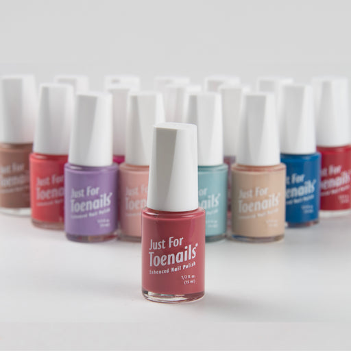 Row of 'Just For Toenails' nail polish bottles on a white background